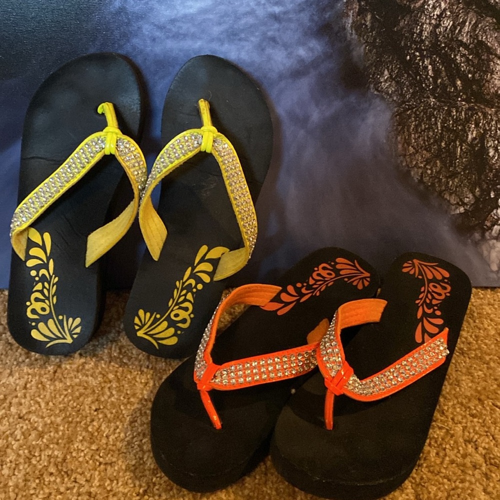 Bright orange and yellow flip flops or sandals 🏖️